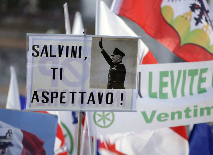 A placard reading "Salvini, expecting you," with a picture of Italian wartime dictator Benito Mussolini, is held up at a rally held by Northern League party leader Matteo Salvini in Rome, February 28, 2015. (Reuters/Max Rossi)
