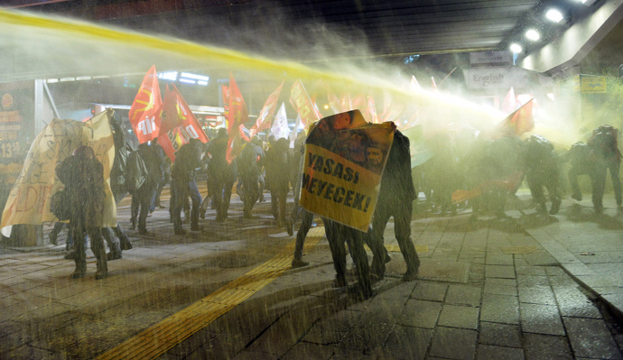 Riot police use water cannon to disperse demonstrators during a protest in Ankara March 11, 2015. (Reuters / Stringer)