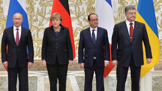 February 11, 2015. From left: Russian President Vladimir Putin, German Chancellor Angela Merkel, French President Francois Hollande and Ukrainian President Petro Poroshenko pose for a group photo at Independence Palace in Minsk after restricted attendance peace talks on Ukraine held by the Russian, German, French and Ukrainian leaders.(RIA Novosti / Viktor Tolochko)