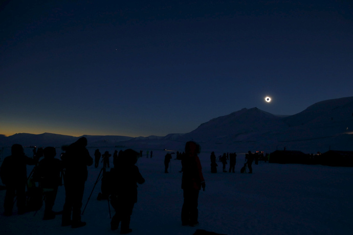 People look at a total solar eclipse on Svalbard March 20, 2015. (Reuters / Haakon Mosvold Larsen)