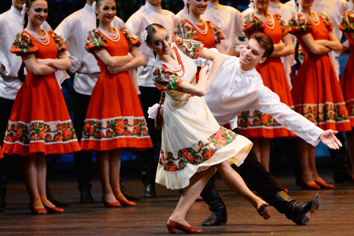 Members of the Igor Moiseyev Folk Dance Company perform the Russian dance entitled "Summer" at the Bolshoi Theatre in Moscow. (RIA Novosti / Vladimir Vyatkin)
