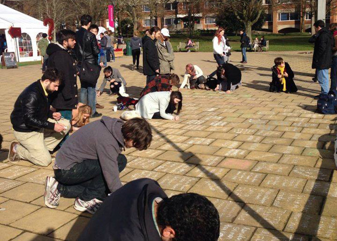 Sussex students write the names of more than 2,000 Palestinian victims of Israel's military operation in Gaza last summer. (Credit: Sussex Friends of Palestine Society)
