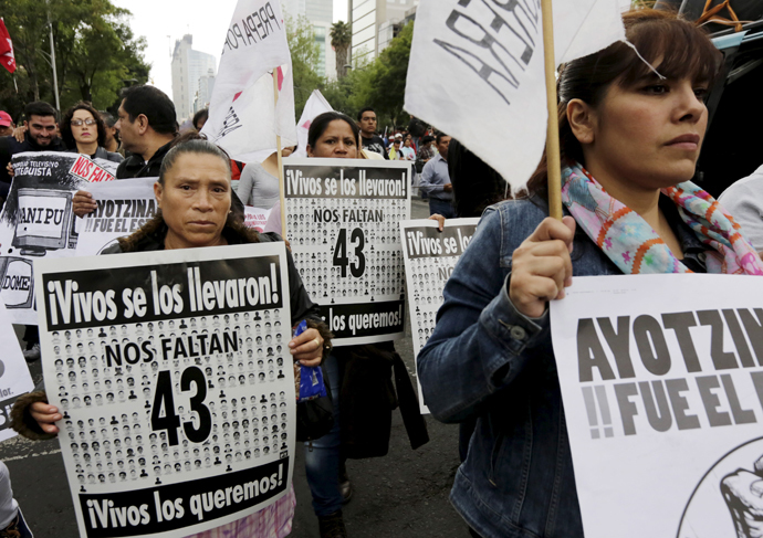 Relatives take part in a march calling for justice for 43 missing students, on the six-month anniversary of their disappearance, in Mexico City, March 26, 2015. (Reuters/Henry Romero)