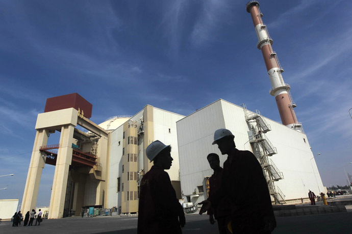 Iranian workers stand in front of the Bushehr nuclear power plant. (Reuters/Majid Asgaripour)