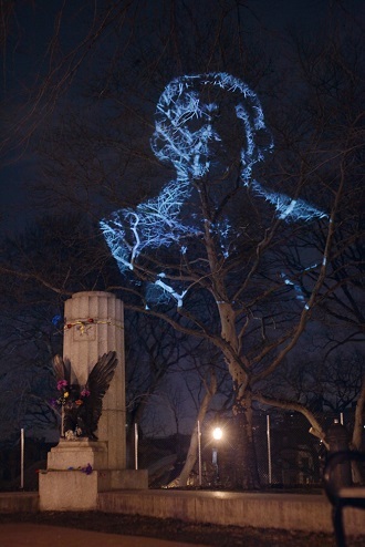 An image of Edward Snowden cast over where a sculpture of him stood earlier. (The Illuminator)
