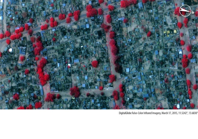 Imagery from 17 March 2015, shows extensive damage a neighbourhood that was intact on March 3. Red colour indicates healthy vegetation, while darker colors indicate burned areas.