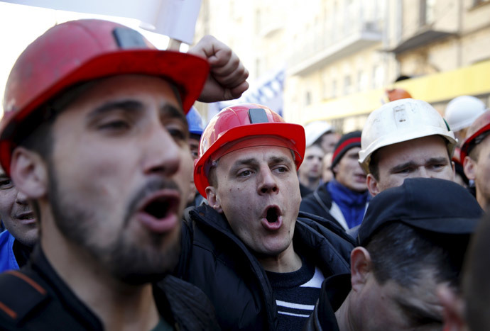 Miners shout slogans during a rally to demand the payment of their salaries from the government in central Kiev April 22, 2015. (Reuters / Valentyn Ogirenko)