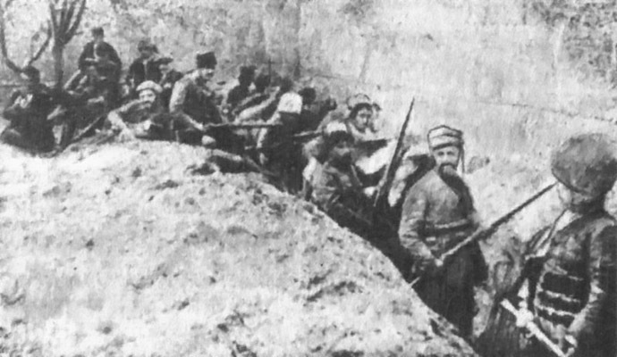 Armed Armenian civilians and self-defense units holding a line against Ottoman forces in the walled Siege of Van in May 1915. (Image from Wikipedia)