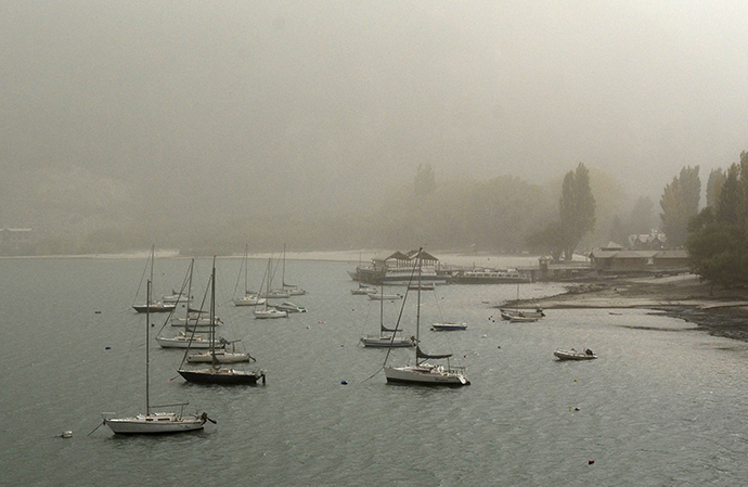 Boats are seen on the Lacar lake covered with ash from the Calbuco volcano in the Patagonian Argentine area of San Martin de Los Andes April 23, 2015 (Reuters / Patricio Rodriguez)