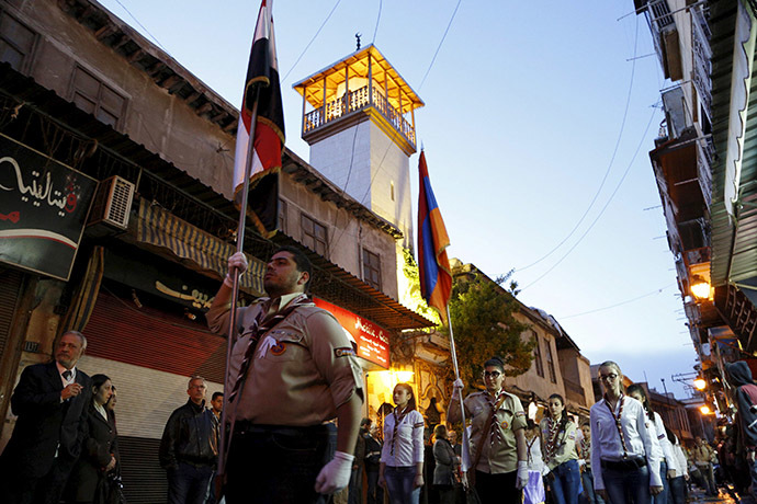 Syrian Armenian scouts carry a Syrian and an Armenian national flags as they march in the old city of Damascus, April 23, 2015, to mark the 100th anniversary of the mass killing of Armenians in the Ottoman Empire in 1915. Picture taken April 23, 2015. (Reuters/Omar Sanadiki)