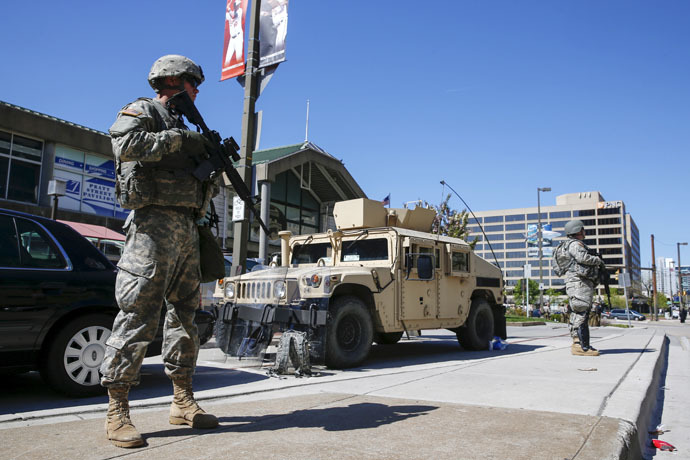 Members of the Maryland National Guard patrol the harbor section of Baltimore, Maryland April 28, 2015. (Reuters/Shannon Stapleton)