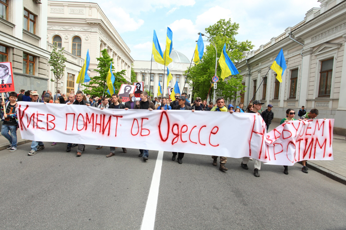 Demonstrators march in Kiev in memory of the victims of the 2014 Trade Unions House massacre.