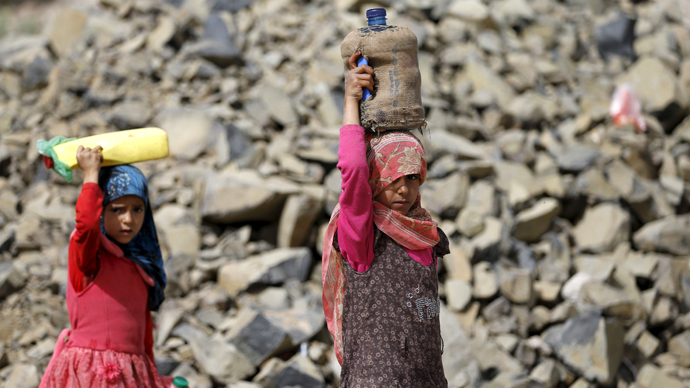 Girls carry jerrycans they filled with water from a public tap amid an acute shortage of water supply to houses in Sanaa (Reuters / Khaled Abdullah)
