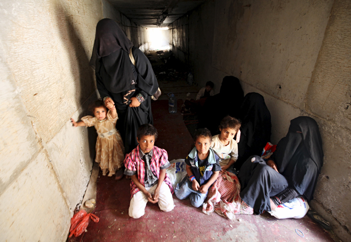 Displaced people rest in an underground water tunnel after they were forced to flee their homes due to ongoing air-strikes carried out by the Saudi-led coalition in Sanaa May 2, 2015. (Reuters / Mohamed al-Sayaghi)