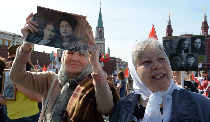 Participants during the march of the Immortal Regiment Moscow regional patriotic public organization on Red Square. (RIA Novosti/Iliya Pitalev)