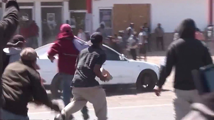 Dozens of protesting Mexican farm workers injured in clashes with police amid violent crackdown