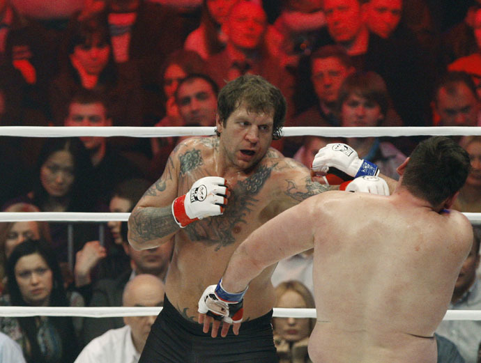 Russian Alexander Emelianenko (background) and Lithuanian Tadas Rimkyavichus (foreground) leads in the mixed martial arts M-1 Challenge 31 fight in St. Petereburg. (Reuters/Vadim Zhernov)