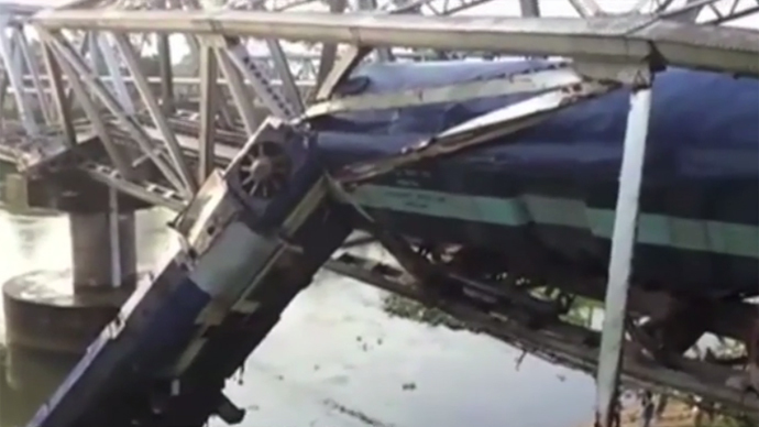 ​Train derails while navigating bridge in India, multiple injuries (VIDEO)
