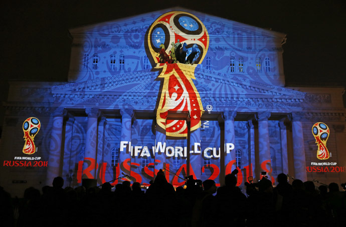 Journalists look at a light installation showing the official logotype of the 2018 FIFA World Cup during its unveiling ceremony at the Bolshoi Theater building in Moscow, October 28, 2014.(Reuters/Maxim Shemetov)
