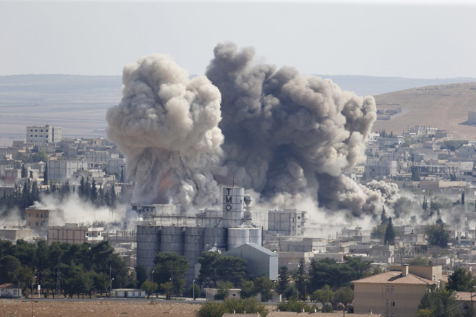 Smoke rises after an U.S.-led air strike in the Syrian town of Kobani on October 8, 2014. (Reuters/Umit Bektas)