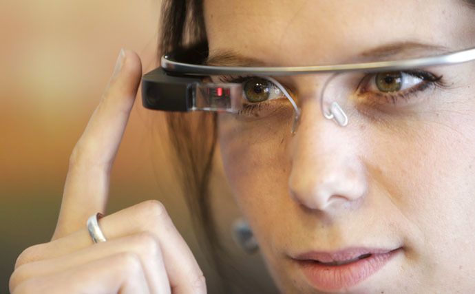 A woman wears Google glasses after a media presentation of a Google apartment in Prague May 15, 2014. (Reuters/David W Cerny)