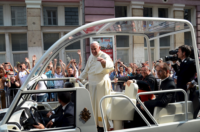 Pope Francis waves from his 'Popemobile' along a street in Sarajevo, Bosnia and Herzegovina June 6, 2015. (Reuters / Stringer)