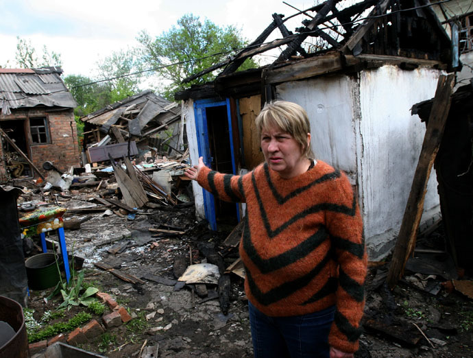 A woman by her ruined house after a Ukrainian military artillery attack on Gorlovka, Donetsk region. (RIA Novosti/Igor Maslov)