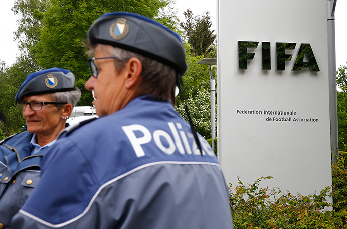 Police officers stand in front of the FIFA headquarters during an extraordinary Executive Committee meeting in Zurich, Switzerland (Reuters / Arnd Wiegmann)