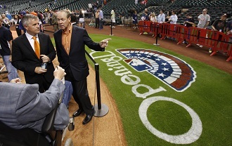 Houston Astros owner Jim Crane (R) and General Manager Jeff Luhnow (L) on Opening Day in Houston March 31, 2013. (Reuters/Richard Carson)