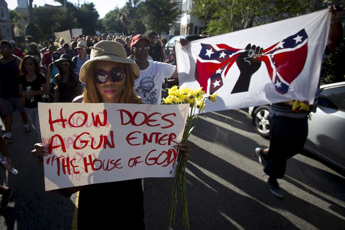 People take part in "Black Lives Matter" march around Emanuel African Methodist Episcopal Church in Charleston, June 20, 2015. (Reuters/Carlo Allegri)