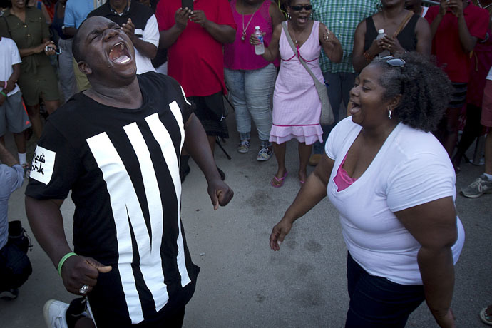 People sing hymns outside Emanuel African Methodist Episcopal Church in Charleston, June 20, 2015. (Reuters/Carlo Allegri)