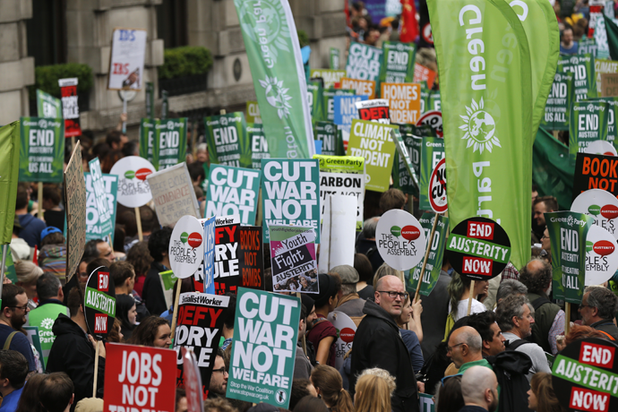 Demonstrators march during an anti-austerity protest in London, Britain June 20, 2015. (Reuters / Suzanne Plunkett)