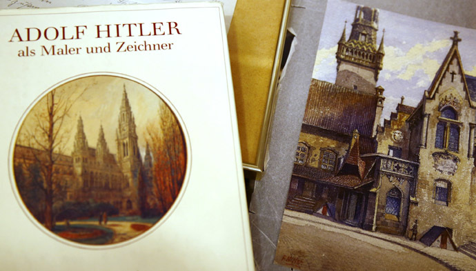 A watercolour of the old registry office in Munich by former German dictator Adolf Hitler lies next to a catalog of his paintings and drawings at Weidler auction house in Nuremberg. (Reuters / Kai Pfaffenbach)