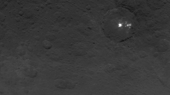 A cluster of mysterious bright spots on dwarf planet Ceres can be seen in this image, taken by NASA's Dawn spacecraft on June 9, 2015. (Image credit: NASA/JPL-Caltech/UCLA/MPS/DLR/IDA)