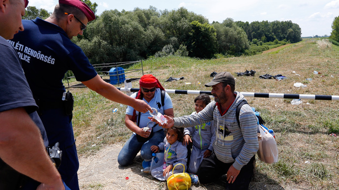 Hungarian police fire tear gas to 'pacify' overcrowded migrant camp