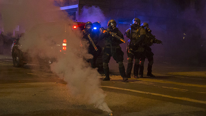 Justice Dept. blasts Ferguson police response to protests in leaked report