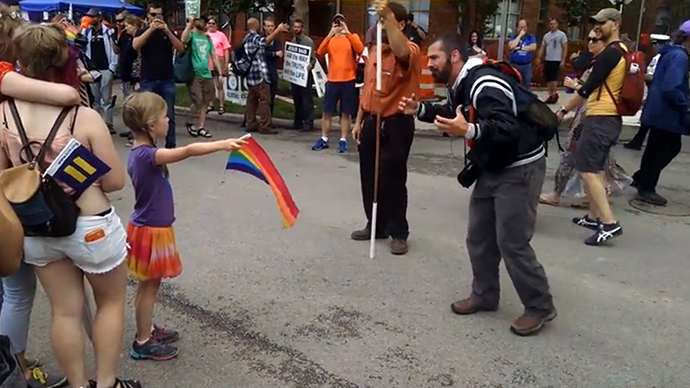 Little girl with rainbow flag vs Christian activist (VIDEO)