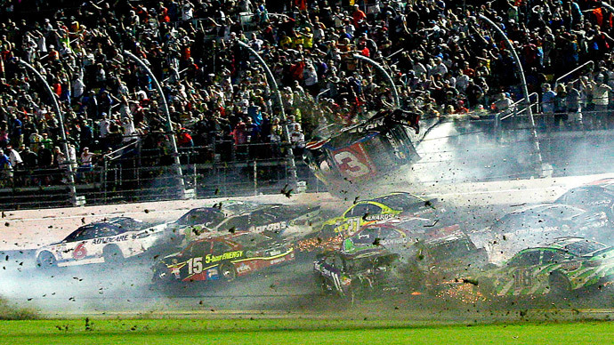 Car flies into fence in horrible NASCAR crash, driver stays alive (VIDEO)