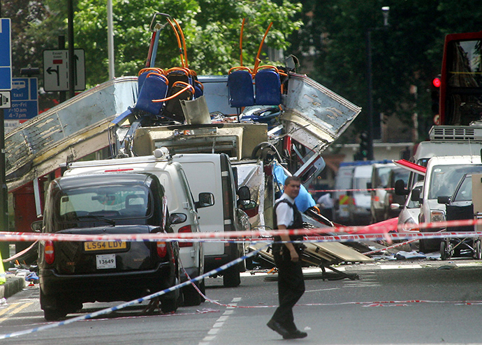 ARCHIVE PHOTO: An emergency worker walks near the scene of an explosion near Russell Square in London July 7, 2005 (Reuters / Mike Finn-Kelcey)