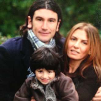 This is a picture of Emmy Georgiou, her husband and child Amelio the year of the terror attack