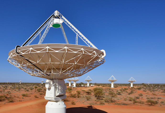 Close up of an ASKAP antenna with several more in the background. (image from wikipedia.org by CSIRO)