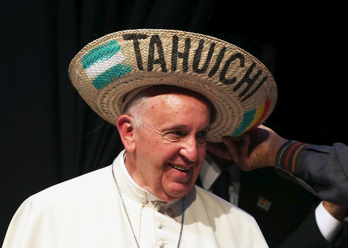 Pope Francis receives a typical sombrero from Bolivian President Evo Morales during a World Meeting of Popular Movements in Santa Cruz, Bolivia, July 9, 2015. (Reuters/Alessandro Bianchi)