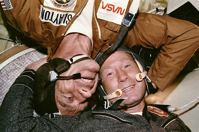 Astronaut Donald K. "Deke" Slayton embraces cosmonaut Aleksey Leonov in the Soyuz spacecraft (Image from nasa.gov)