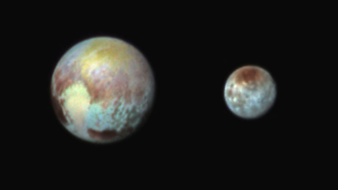 Pluto and Charon Shine in False Color (Photo credit: NASA)