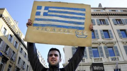 Greece agrees to raise retirement age, discusses further cuts