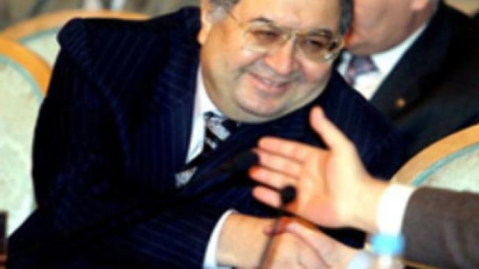 Russian tycoon Usmanov bites bigger piece of Arsenal's cake