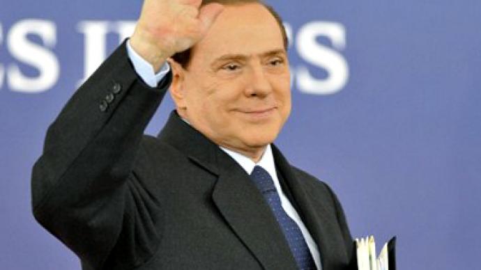 A sea of red as Berlusconi steps down 