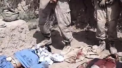 US troops defile Afghan corpses again, pose with body parts