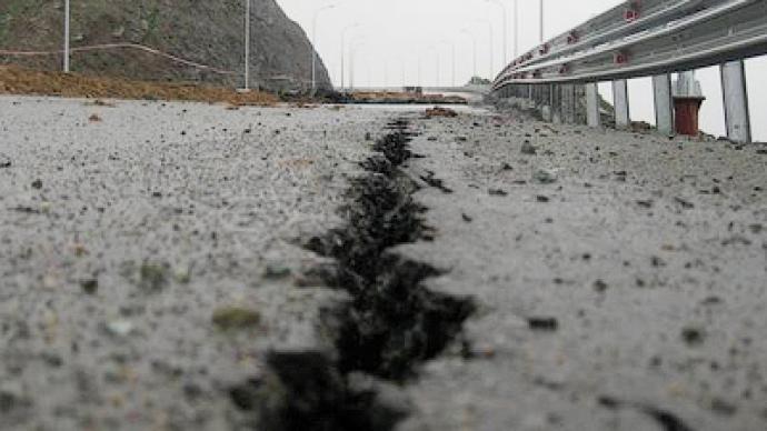 Down the drain in the rain: $1 billion highway washed away in Far East