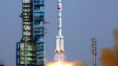 China launches lunar probe with first moon rover aboard